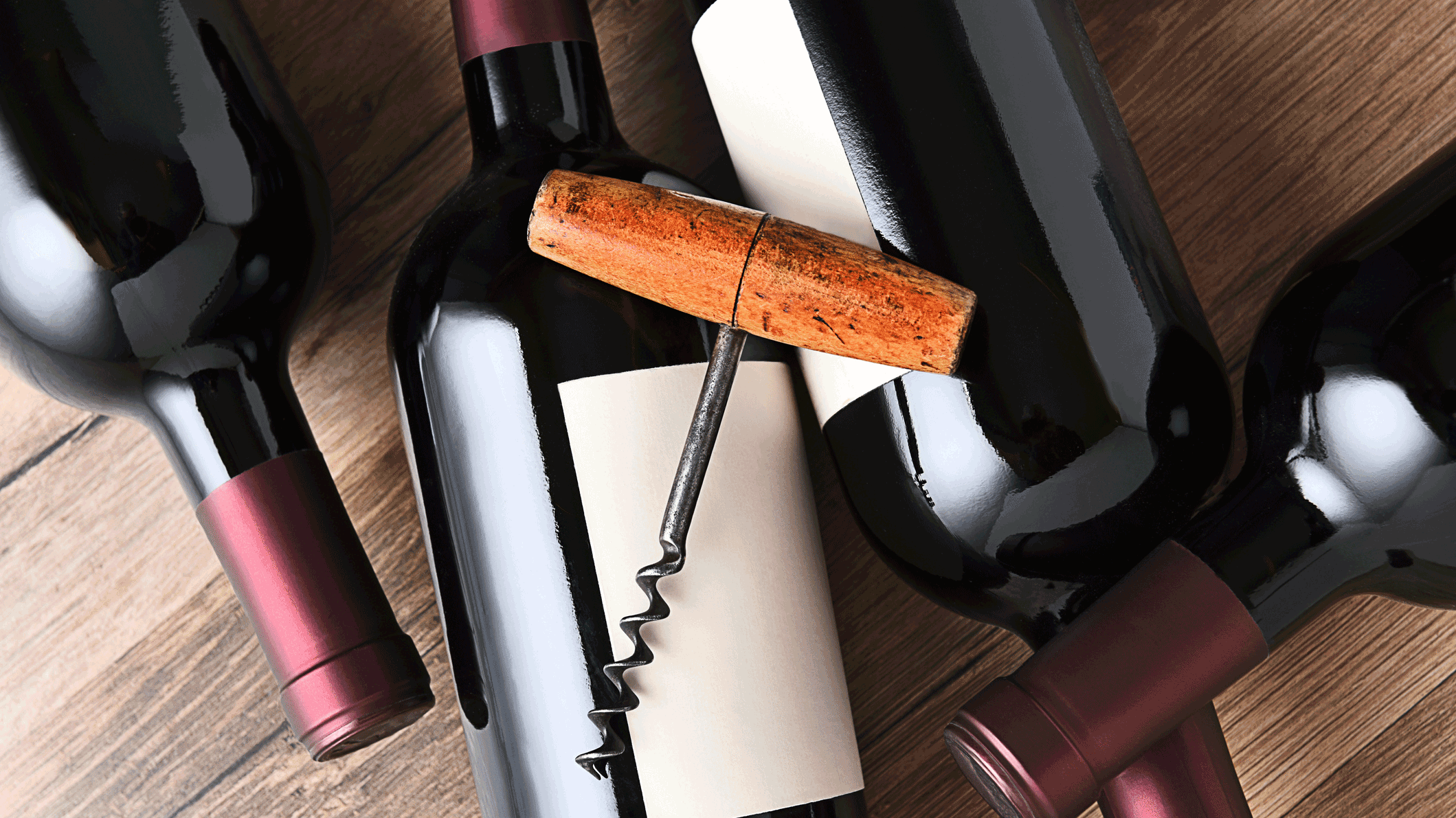 Bottles of dry red wine including Cabernet, Merlot, and Pinot Noir